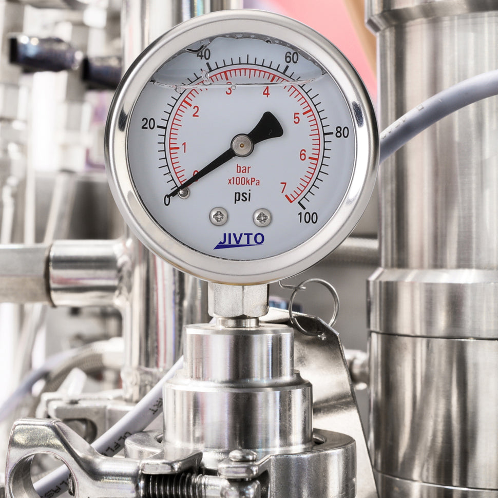 JIVTO liquid filled pressure gauge used in industrial pipe.
